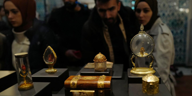 Visitors examine objects on display at the Chamber of Holy Relics at Topkapı Palace